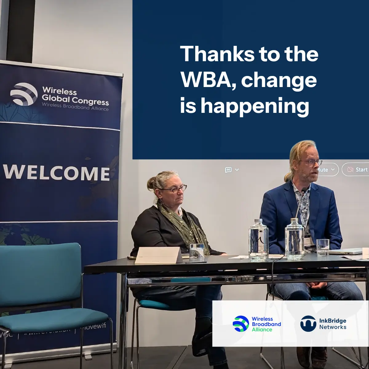 Two people sitting at a table with a banner reading "Wireless Global Congress" and a sign that says "WELCOME" in the background, with logos of Wireless Broadband Alliance and InkBridge Networks visible; a presentation screen with text "Thanks to the WBA, change is happening".